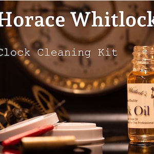 May include: A clock cleaning kit with a bottle of clock oil, a small screwdriver, and two white felt pads. The bottle is labeled "Whitlock's Clock Oil" and says "For The Professional".