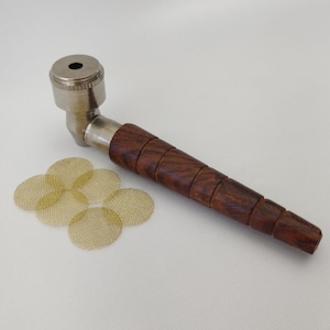 May include: A silver metal pipe with a wooden handle and a set of six gold metal screens.