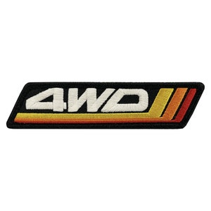 May include: A black embroidered patch with the text "4WD" in white, with a yellow, orange and red stripe design.