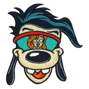 May include: An embroidered patch featuring a cartoon dog character with black hair, wearing red-rimmed teal sunglasses that reflect a small image of a person with brown hair. The character has a tan muzzle, black nose, and white teeth.