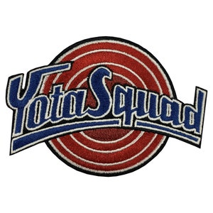 May include: A blue and white embroidered patch with the text "Yota Squad" in a curved font. The patch features a red and white target design in the background.