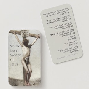 May include: A religious card featuring an artistic depiction of Jesus on the cross, with the text "SEVEN LAST WORDS OF JESUS." A second card displays quotes from the Bible. The background is a light beige color.
