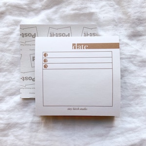 May include: A white notepad with a brown header that says "date". The notepad has three lines for writing and a small logo at the bottom that says "tiny birch studio".