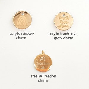May include: Three gold charms for a necklace or bracelet. The first charm is a rainbow, the second charm says "teach love grow", and the third charm says "#1 teacher" with a star.