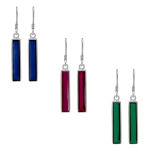 May include: Three pairs of dangle earrings with silver hooks and rectangular colored stones. The first pair has blue stones, the second pair has red stones, and the third pair has green stones.