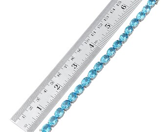 thumbnail interactive-video image 1 of Celtic Knot Blue Topaz Round Hoop Earrings In Sterling Silver | 0.8 TCW 1 of 3