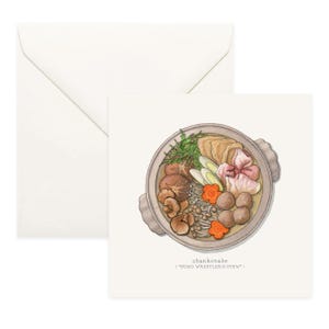 May include: Greeting card featuring a watercolor illustration of chankonabe, a Japanese stew. The dish is in a round, light brown bowl and includes mushrooms, meatballs, tofu, and vegetables. The card is accompanied by a white envelope.