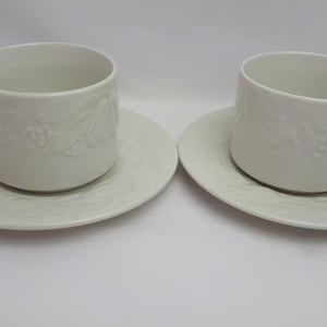 Two Vintage Fruit De Blanc Tabletops Unlimited White Cups & Saucers Embossed Coffee