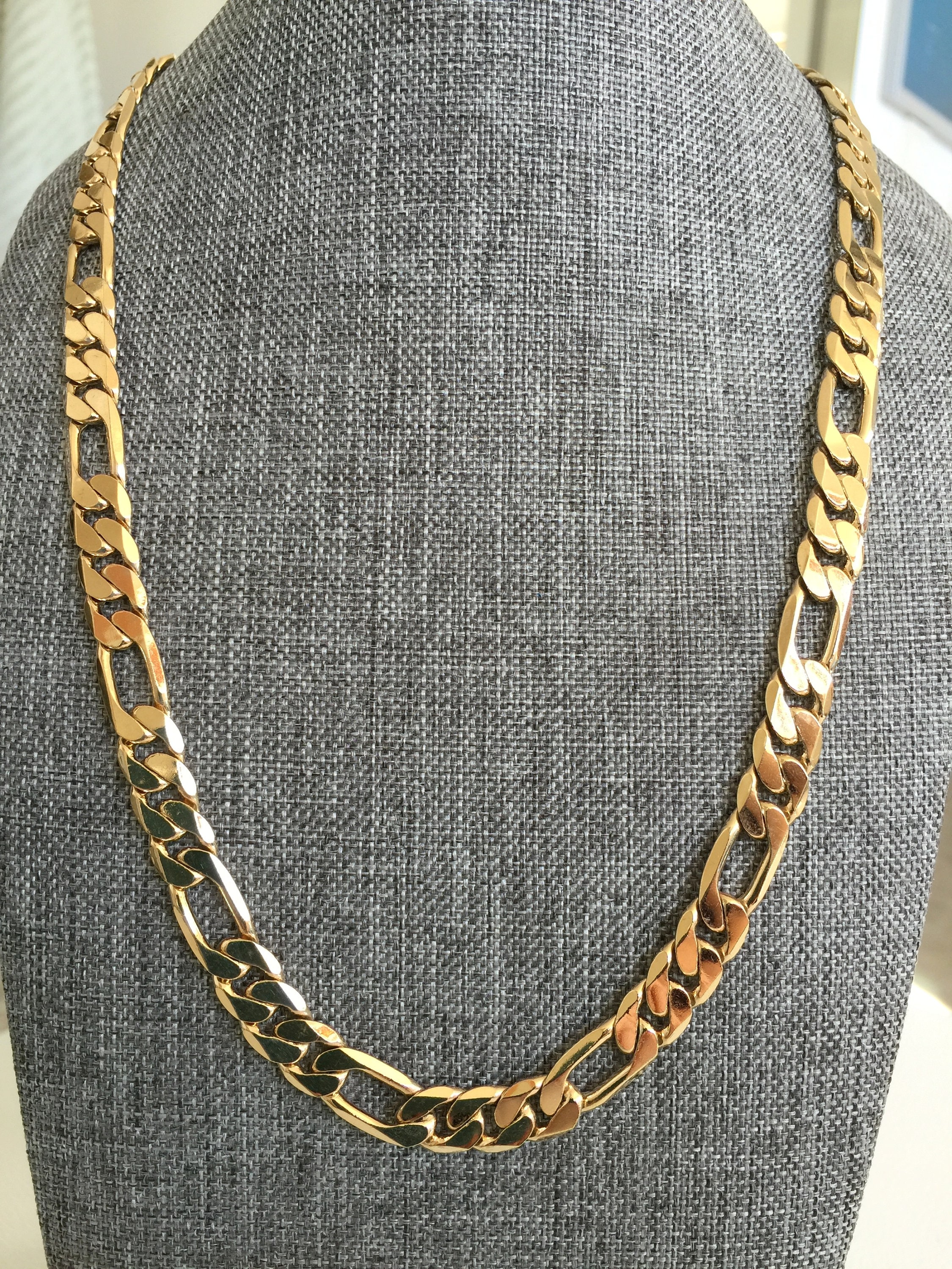 gold chain with collared shirt