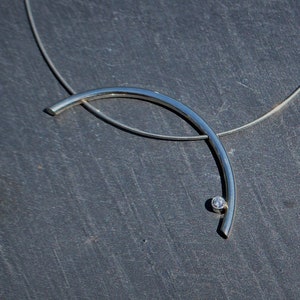 Silver pendant on a silver omega necklace with Zirconia stone