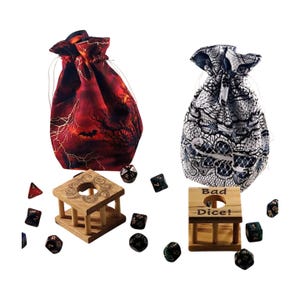 May include: Two drawstring dice bags, one red with a spooky design and the other white with a lace pattern. Wooden dice holders with dice scattered around. One holder says "Bad Dice!"