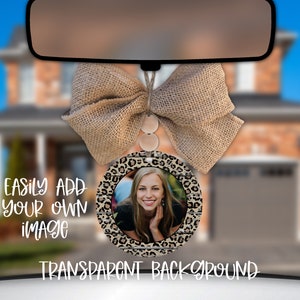 May include: A round car air freshener with a leopard print design and a woodgrain border. The air freshener has a clear plastic window that allows you to insert a photo. The text "EASILY ADD YOUR OWN IMAGE" and "TRANSPARENT BACKGROUND" is visible in the image.