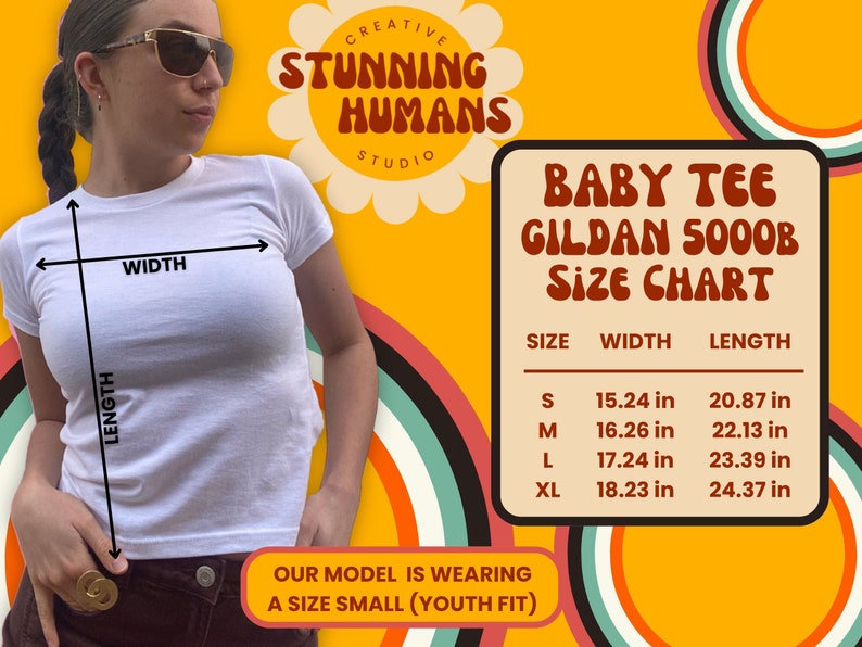 May include: A white baby tee shirt with a size chart showing measurements in inches. The chart includes sizes S, M, L, and XL. The text "Baby Tee Gildan 5000B Size Chart" is displayed in red and white.