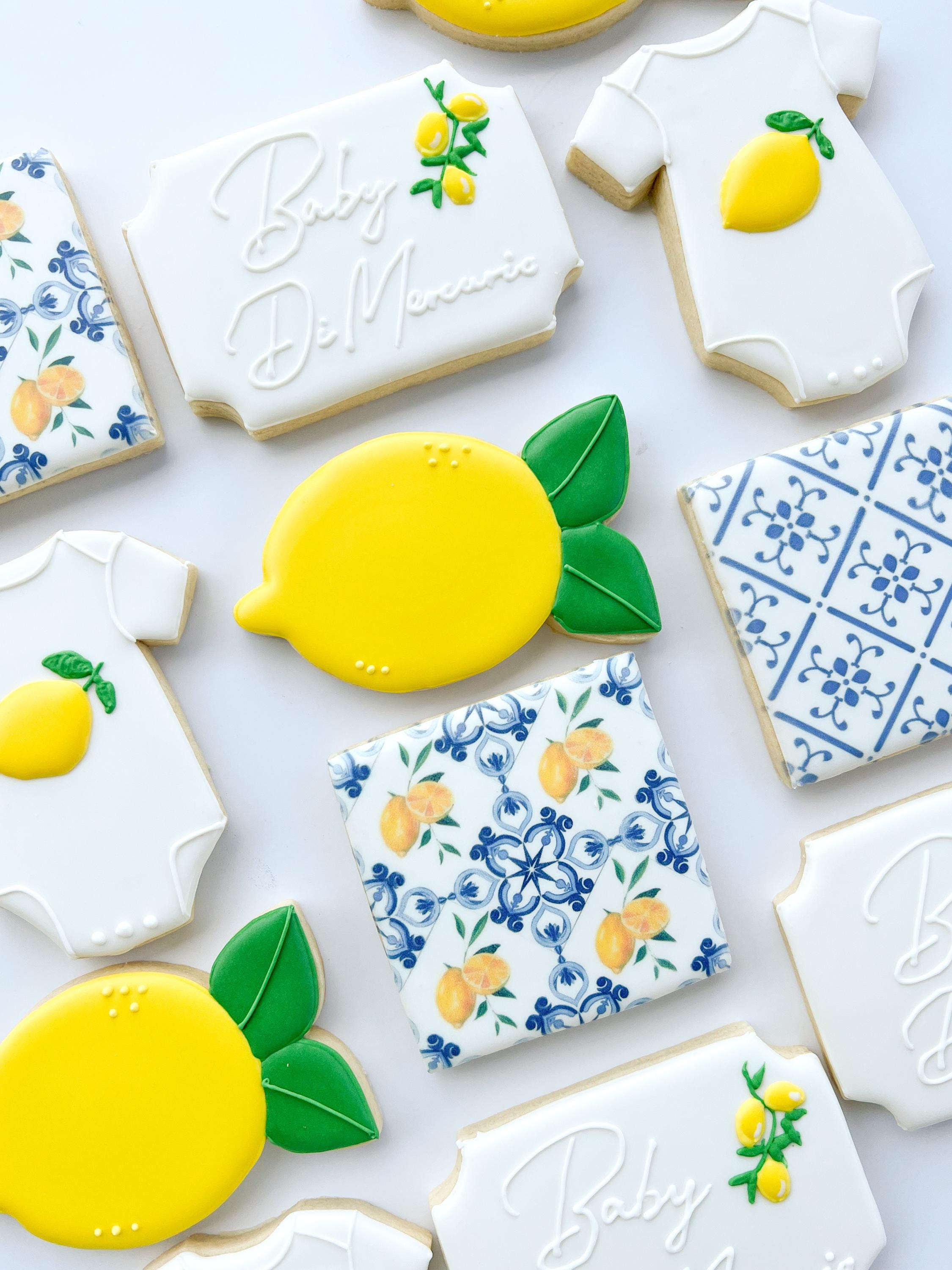 Lemon blue tile Mediterranean Baby Shower sugar cookies, personalized baby onesie with lemon shower favors from grandma, 1 dz