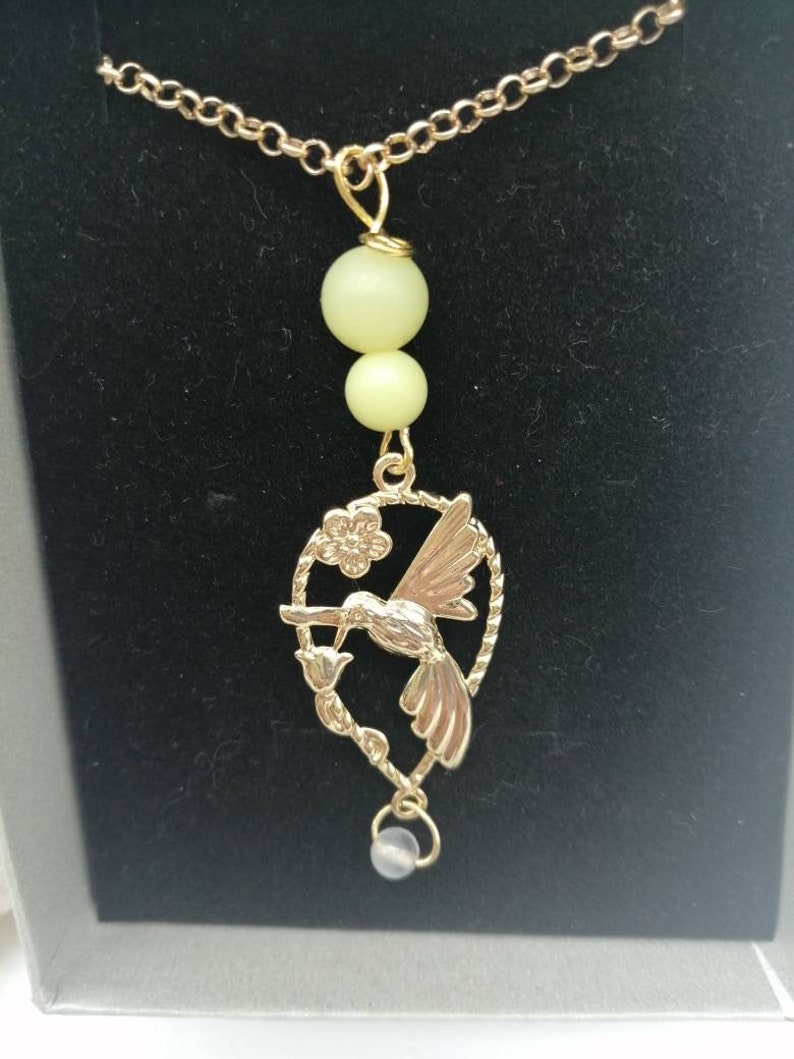 Magic Elf peripedot and white moonstone Earring available from 60 euros! gold-plated chain and gift box offered
