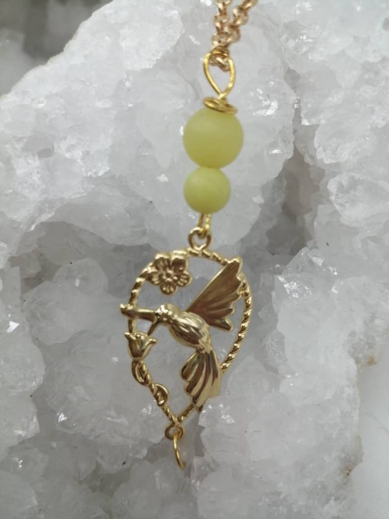 Magic Elf peripedot and white moonstone Earring available from 60 euros! gold-plated chain and gift box offered