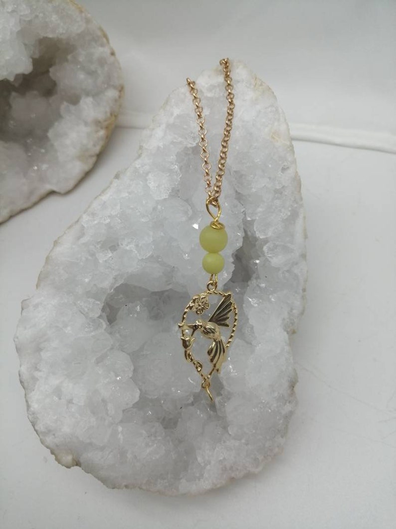 Magic Elf peripedot and white moonstone Earring available from 60 euros! gold-plated chain and gift box offered