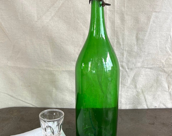 A Large Antique Emerald Green Champagne Bottle