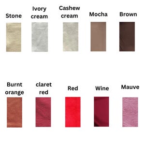 A selection of fabric swatches displaying a range of colours. The palette includes stone, ivory cream, cashew cream, mocha, brown, burnt orange, claret red, red, wine, and mauve. Each swatch is labelled with its colour name.