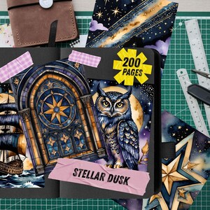 May include: A black journal with a watercolor illustration of a ship, owl, and celestial elements. The journal has 200 pages and is decorated with washi tape. The words "Stellar Dusk" are visible.