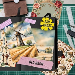 May include: A black notebook featuring a watercolor illustration of a windmill in a field, a mushroom pattern, and a key pattern. A yellow star-shaped sticker reads 230 PAGES, and a pink tape strip reads OLD BARN. A ruler and scissors are visible.