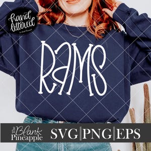 May include: A navy blue sweatshirt with the word "RAMS" written in white cursive lettering.