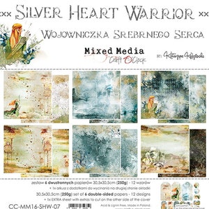 May include: A set of 6 double-sided scrapbook papers featuring a whimsical warrior woman with a silver heart, surrounded by nature elements. The papers are 12 inches by 12 inches and are acid and lignin free. The papers are made in Poland. The set includes an extra sheet with extras to cut on the other side of the cover.  CC-MM16-SHW-07