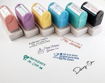May include: Six self-inking stamps in pink, purple, yellow, blue, teal, and black. Each stamp displays a custom imprint: Anderson Family address, Happy Birthday Grandma Sue, My Etsy Shop, Made from Scratch by Mr. Cook, Please Sign and Return to Ms. Johnson, and a signature.