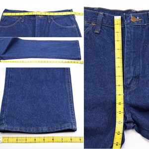 May include: A pair of blue denim jeans with a yellow measuring tape showing the inseam length of 32 inches and the waist measurement of 30 inches.