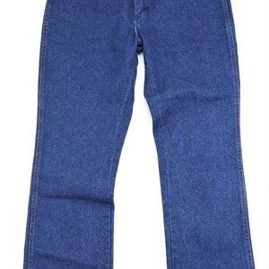May include: A pair of dark blue denim jeans with a straight leg fit.