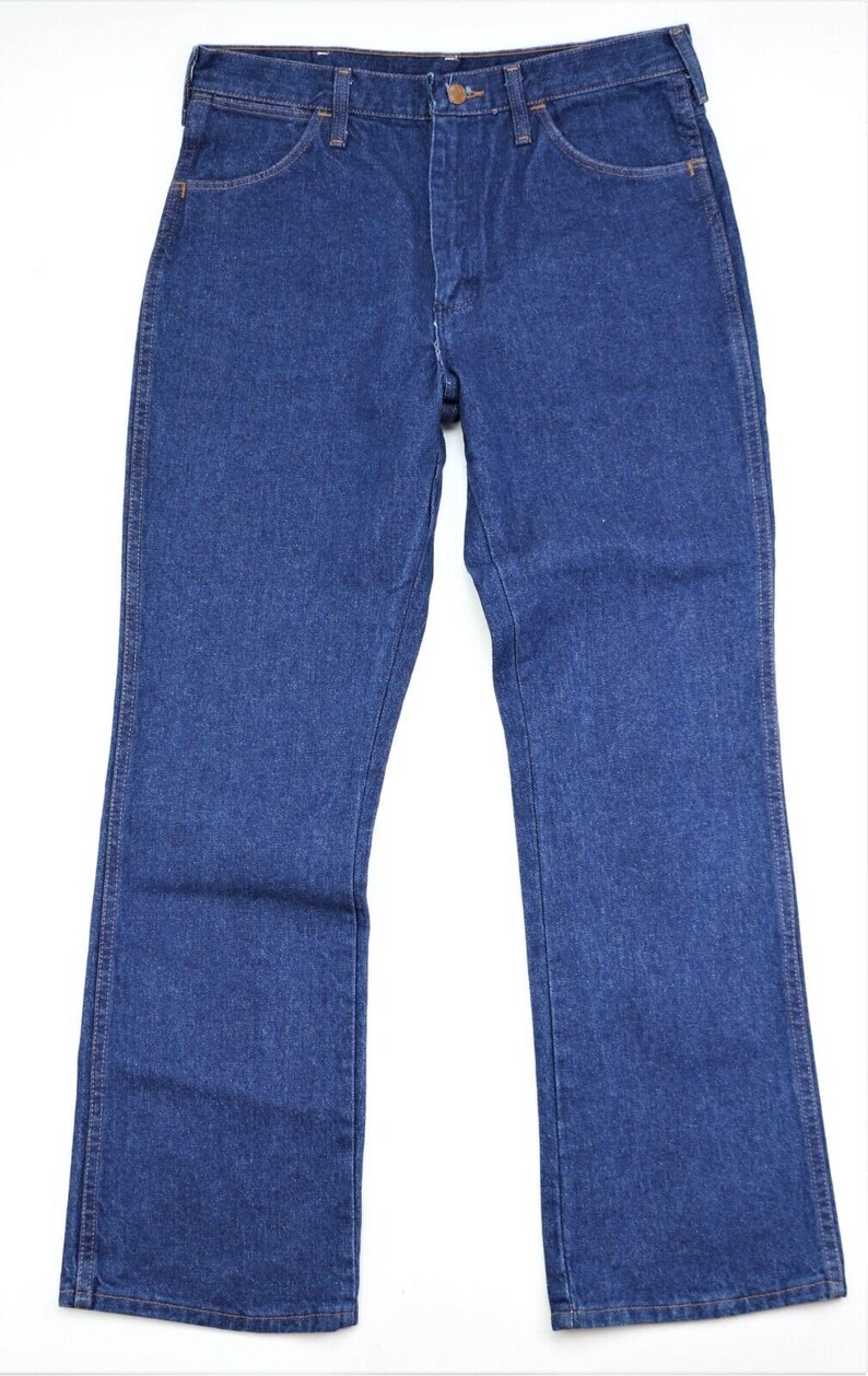 May include: A pair of dark blue denim jeans with a straight leg fit.