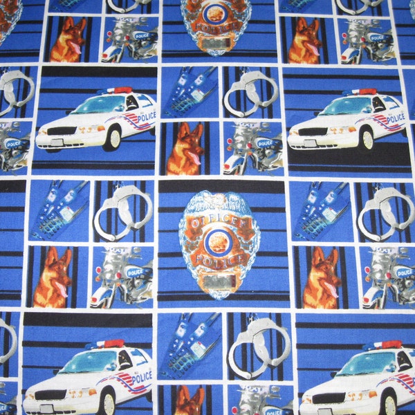 Police dept. on blocks.  Blue 100% cotton fabric.  Licensed.  New, not washed.  Sold by the yard.