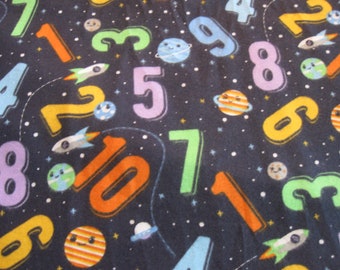 Flannel fabric numbers, spaceships, Saturn, stars. Children. 100% cotton. Sold by the yard 42 inches wide. New not washed.