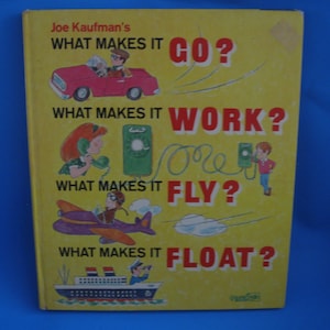 May include: A yellow book cover with the title "What Makes It Go?" and illustrations of a car, a phone, a plane, and a boat. The book is by Joe Kaufman.