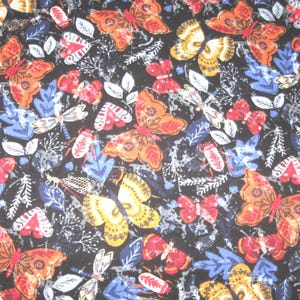 Flannel fabric butterflies, insects, multi-colored, poppy, 100% cotton.    Sold by the yard, 42 inches wide.