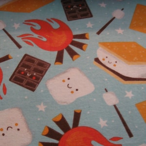 Flannel fabric camp smore.  Camping, roasting, campfire. 100% cotton. Sold by the yard. New not washed.