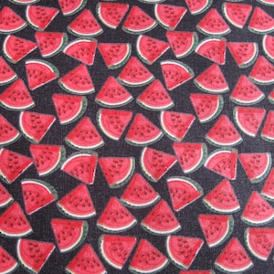 May include: A fabric pattern featuring numerous watermelon slices in red, with black seeds and green rinds, set against a dark background. The design is a repeating pattern, creating a summery, fruity theme.