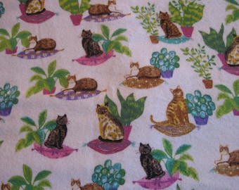 Flannel fabric cats and plants on white, 100% cotton.  New, not washed.  Sold by the yard, 43 inches wide.