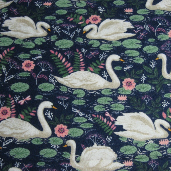 Flannel fabric swans, curious, flowers, lily pads. Navy blue 100% cotton. New. Sold by the yard. 43" wide. Two cuts.