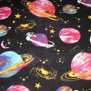 Flannel fabric space, watercolor.  Solar system on 100% cotton.  New, not washed.  Sold by the yard, 42 inches wide.