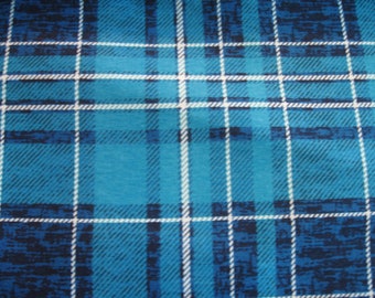 Flannel fabric blue distressed plaid.  White.  100% cotton. New not washed.  Sold by the yard, width 42 inches.