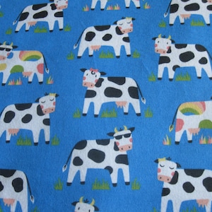 Flannel fabric cows, farm animals.  Children. Realistic.  100% cotton.  Sold by the yard.  New not washed.