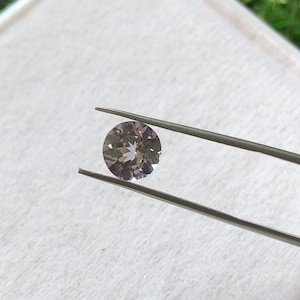 Faceted Tanzanite Gemstone: AAA Quality Round Cut, 0.75 Carat