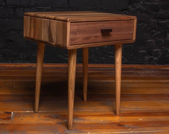 Mid-Century walnut nightstand. Wooden bedside table