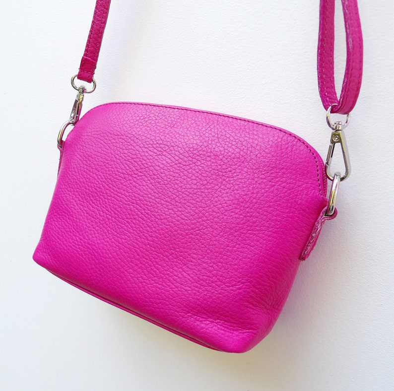 The most useful soft hot pink leather crossbody bag with a long over the body strap, adjustable for your comfort It can be personalised.

Made from super soft pebbled cerise or hot pink leather.  Wear it as a crossbody or shoulder bag.