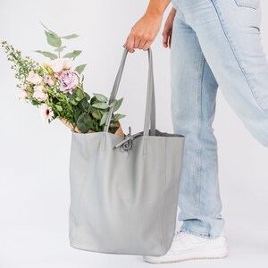 ove Grey leather tote handbag made from wonderfully soft Italian Leather, with a tie top & long handles to fit comfortably over your shoulder and an Internal leather zip pocket for your valuables. An elegant shopper or work handbag.