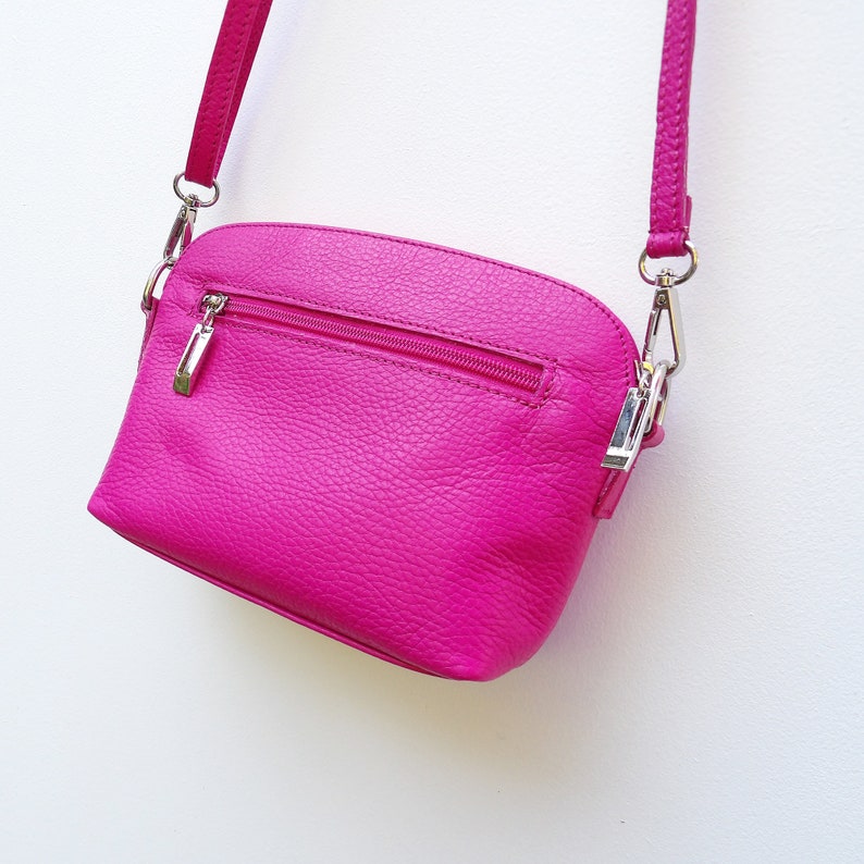 The most useful soft hot pink leather crossbody bag with a long over the body strap, adjustable for your comfort It can be personalised.

Made from super soft pebbled cerise or hot pink leather.  Wear it as a crossbody or shoulder bag.