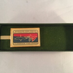 Brass Clip "Migratory Bird Treaty US - Canada" 5 Cent U.S. Postage Stamp