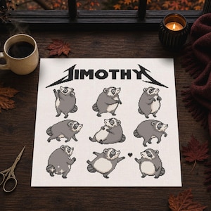 May include: A white square fabric piece featuring a black pixel art design of nine raccoons in various poses and the text "JIMOTHY" in a stylized font at the top. The raccoons are depicted in shades of gray and white with a small black heart icon.