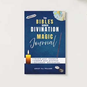 May include: A hardcover book titled "The Bible's Hidden Divination Magic Journal" with a dark blue cover. The cover features a crystal, a wand, a lit candle, and the author's name. The book's title is in white and yellow.